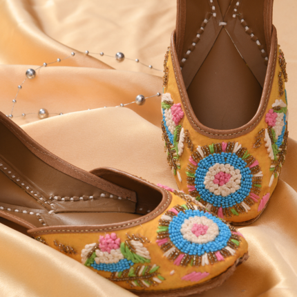 Yellow floral hand embroidered jutti